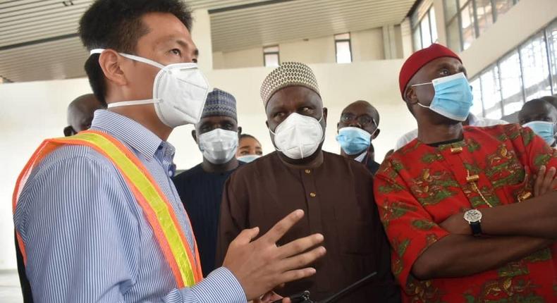 Minister of Transportation, Rotimi Amaechi with the Project Manager of CCECC, Mr Xia Lijun during the inspection of construction works on the Lagos-Ibadan Standard Gauge. [Twitter/@MinTransportNG]