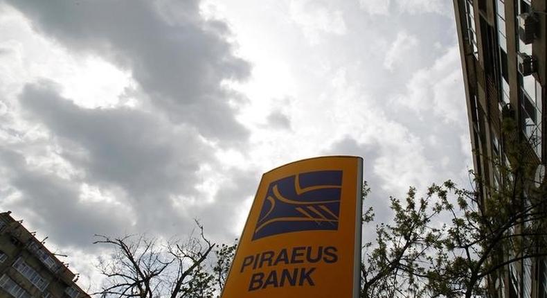 The logo of Piraeus Bank is seen outside one of its branches in Bucharest April 18, 2013. REUTERS/Bogdan Cristel