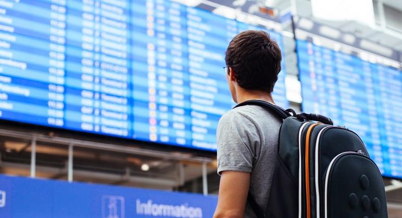 airport man traveler board