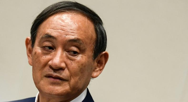Yoshihide Suga was elected leader of Japan's ruling party putting him on track to become the country's next prime minister