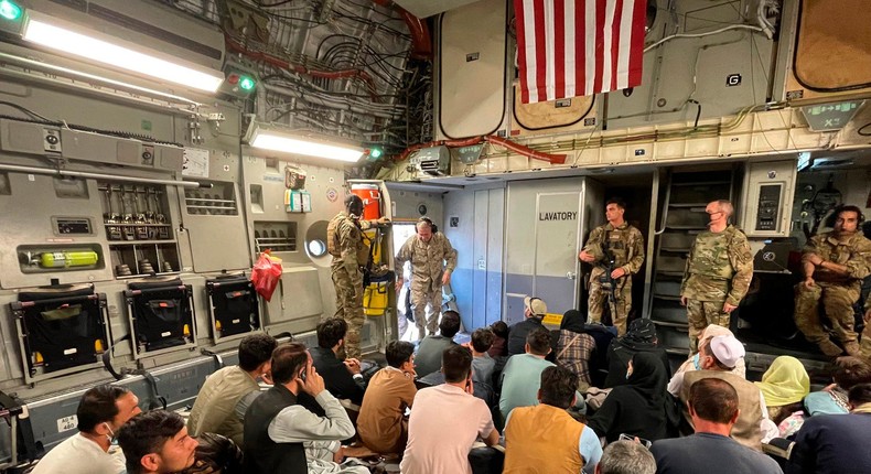 US Marine Corps Gen. Frank McKenzie, the commander of US Central Command, enters a plane evacuating people, at Hamid Karzai International Airport, Afghanistan, on Tuesday, Aug. 17, 2021.
