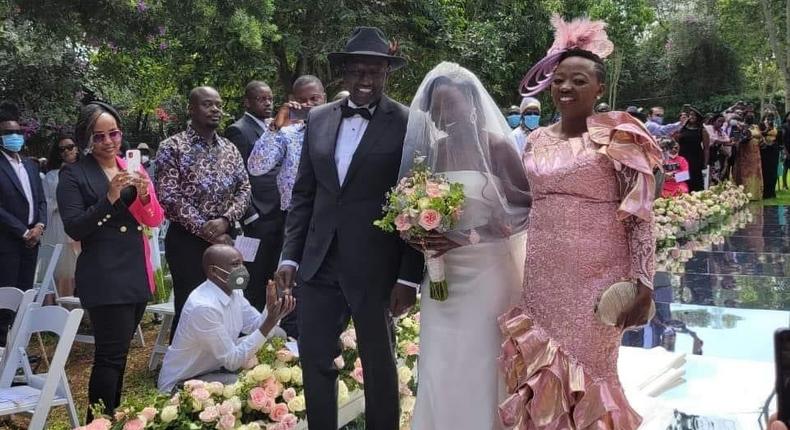 Deputy President William Ruto and wife Rachel walk June Ruto on the aisle at her wedding