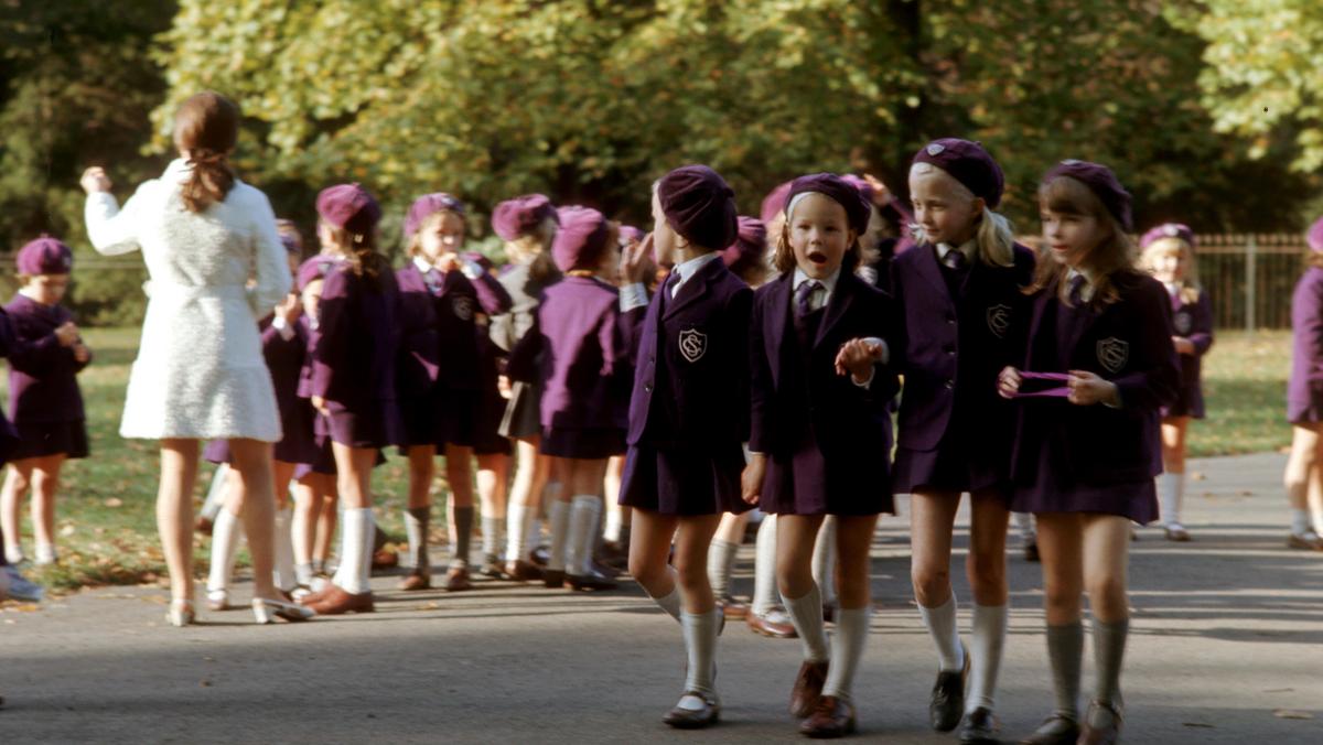 Schoolchildren in uniform walking in Hyde Park, London