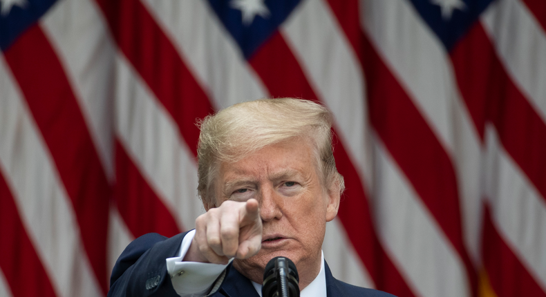 In this May 11, 2020 photo, President Donald Trump points to a question as he speaks about the coronavirus during a press briefing in the Rose Garden of the White House in Washington. Trump has many targets in his war against the media but perhaps none more surprising than the Voice of America, the venerable U.S.-government funded institution created during WWII and expanded during the Cold War to broadcast independent news and promote democracy and American values to the world. In a series of attacks, Trump and his supporters have accused the outlet of