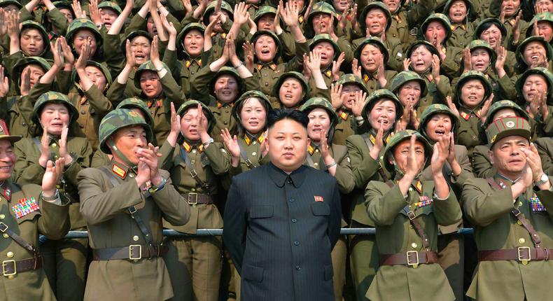 North Korean leader Kim Jong Un receives applause as he guides the multiple-rocket launching drill of women's sub-units under KPA Unit 851, in this undated photo released by North Korea's Korean Central News Agency (KCNA) April 24, 2014.