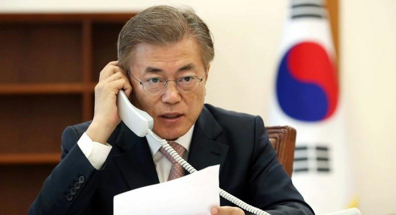 South Korea's new President Moon Jae-In talks to Chinese leader Xi Jinping, at the presidential Blue House in Seoul, on May 11, 2017