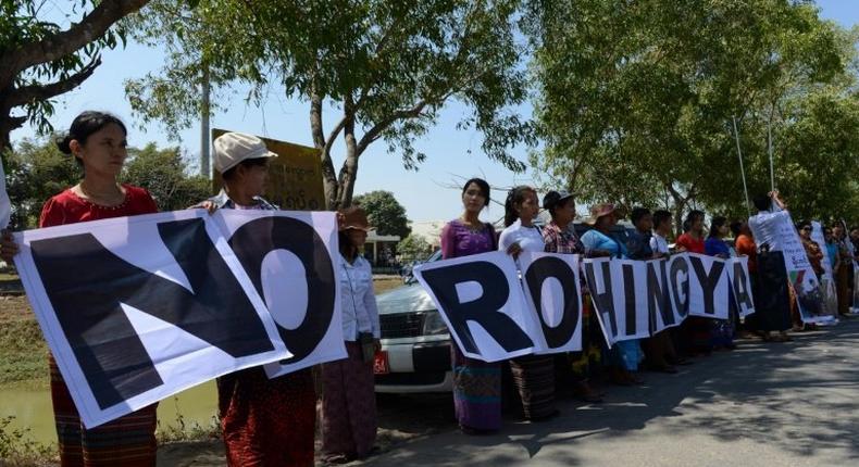 Anti-Rohingya protesters rally at Yangon's Thilawa port as the Malaysian ship carrying relief aid for Rohingya Muslims arrives on February 9, 2017