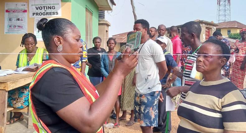 INEC officials attending to voters at a polling unit during the 2023 general elections. [Twitter:@inecnigeria]