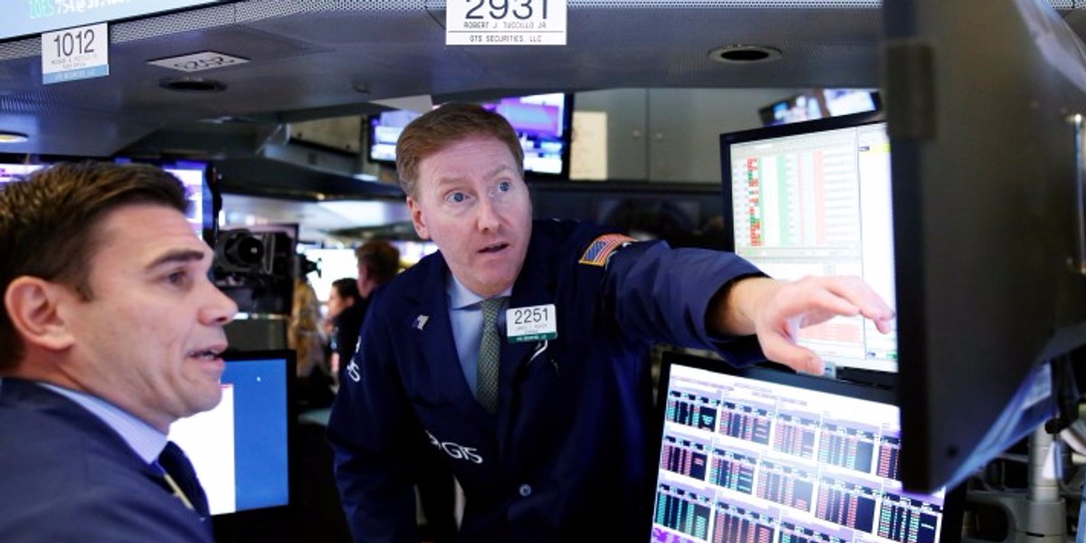 Traders work on the floor of the New York Stock Exchange