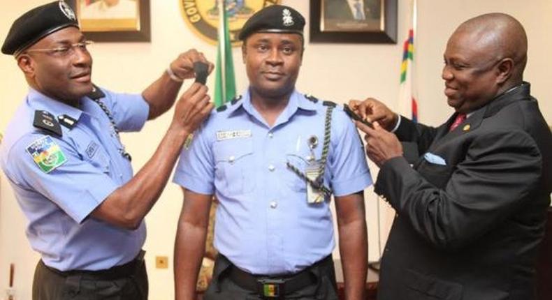 Lagos State Governor, Akinwunmi Ambode decorates his Chief Security Officer (CSO), Saheed Kassim on Tuesday, August 11, 2015.