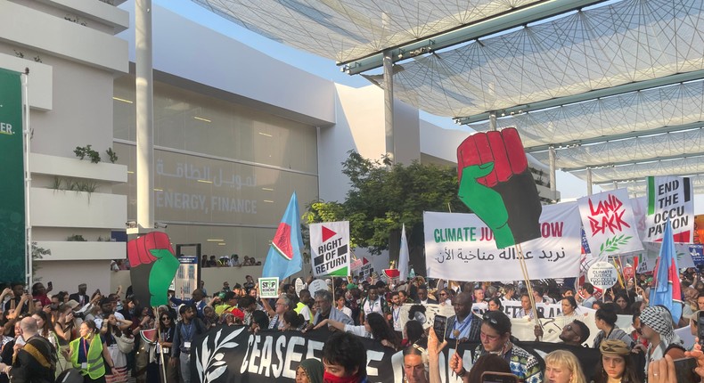 Climate activists march through Expo City in Dubai, host of this year's UN climate summit. Catherine Boudreau/Business Insider