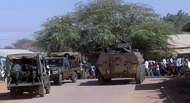 Soldiers of the Kenya Defence Forces patrol at the scene of an attack by Shabaab militants in Mandera, on October 25, 2016