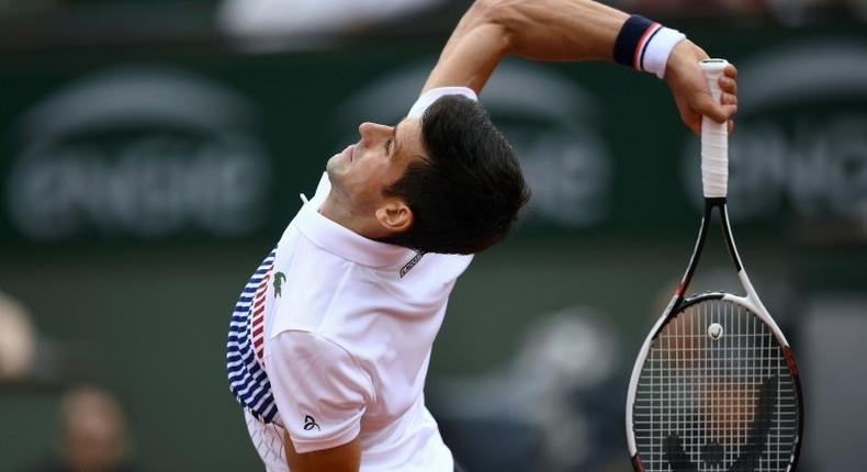 Serbia's Novak Djokovic returns the ball to Spain's Marcel Granollers during their tennis match at the Roland Garros 2017 French Open on May 29, 2017 in Paris