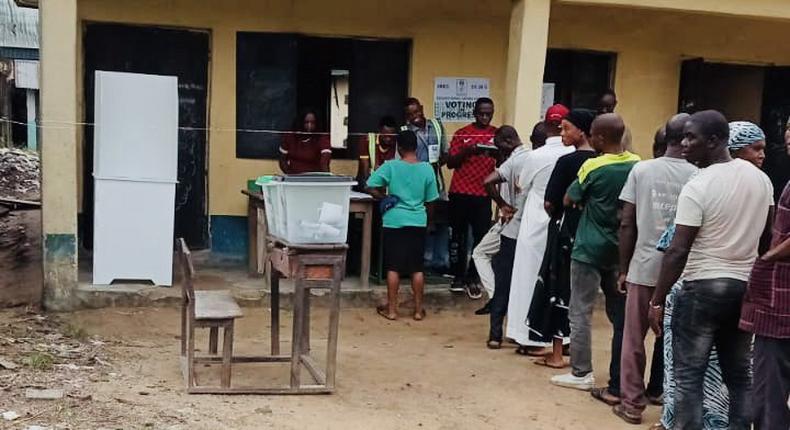 INEC officials attending to voters at a polling unit during the 2023 general elections. [Twitter:@inecnigeria]