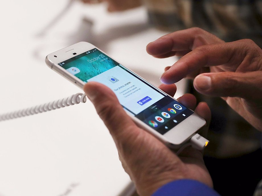 A person trying a new Google Pixel phone at the Google pop-up shop in the SoHo neighborhood on October 20 in New York City.