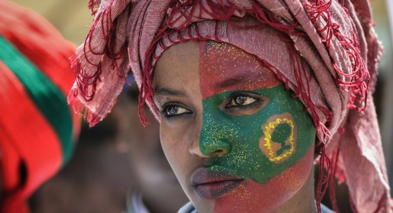 Follower: A woman's face is painted with the flag of the Oromo Liberation Front at celebrations in September 2018 to mark the return of the once-banned OLF to Addis Ababa