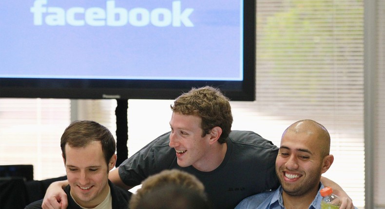 Facebook founder and CEO Mark Zuckerberg greets Facebook employees before speaking at a news conference at Facebook headquarters on on October 6, 2010.
