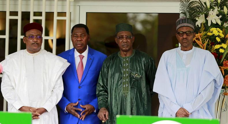 Niger's President Mahamadou Issoufou, Benin's President Thomas Boni Yayi, Chad's President Idriss Deby and Nigeria's President Muhammadu Buhari (L-R) pose during the presentation of the communique of the Summit of Heads of State and Government of The Lake Chad Basin Commission (LCBC) meeting in Abuja, Nigeria, June 11, 2015. Nigeria and its neighbours agreed on Thursday to set up a joint military force to counter Boko Haram, a sign of President Muhammadu Buhari's intent to crush the Islamist militant group early in his tenure. REUTERS/Afolabi Sotunde