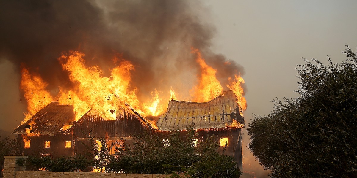 Fire consumes a barn as an out of control wildfire moves through the area on October 9, 2017 in Glen Ellen, California. Tens of thousands of acres and dozens of homes and businesses have burned in widespread wildfires that are burning in Napa and Sonoma counties.