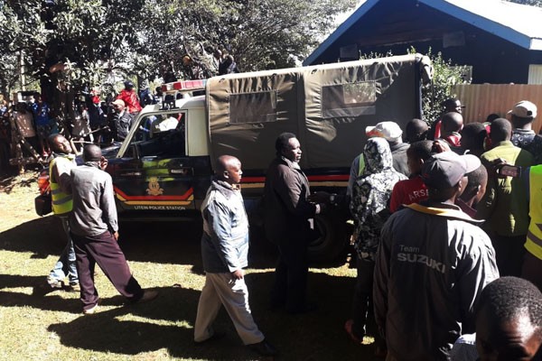 File image of Police Officers and members of the public at a scene of crime