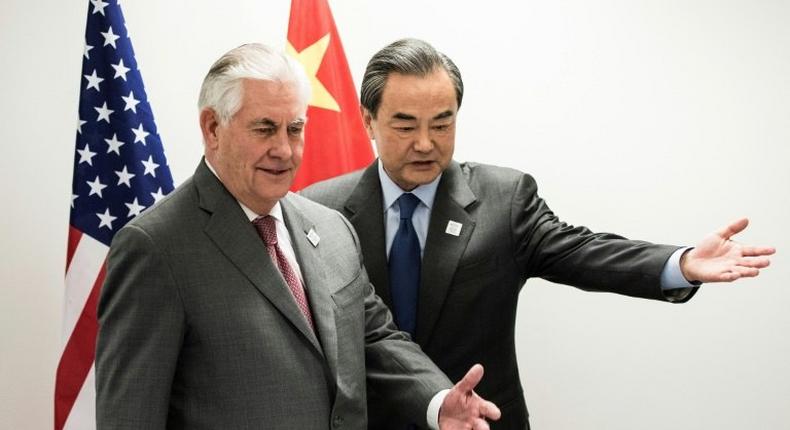 US Secretary of State Rex Tillerson (left) and China's Foreign Minister Wang Yi take their seats before a meeting at the World Conference Center in Bonn, western Germany, on February 17, 2017