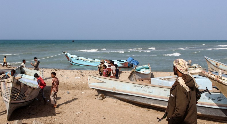 Yemeni fishermen move their boats along a sandy beach in the Khokha district of the western province of Hodeida, on Jan. 21, 2019.Photo by SALEH AL-OBEIDI/AFP via Getty Images