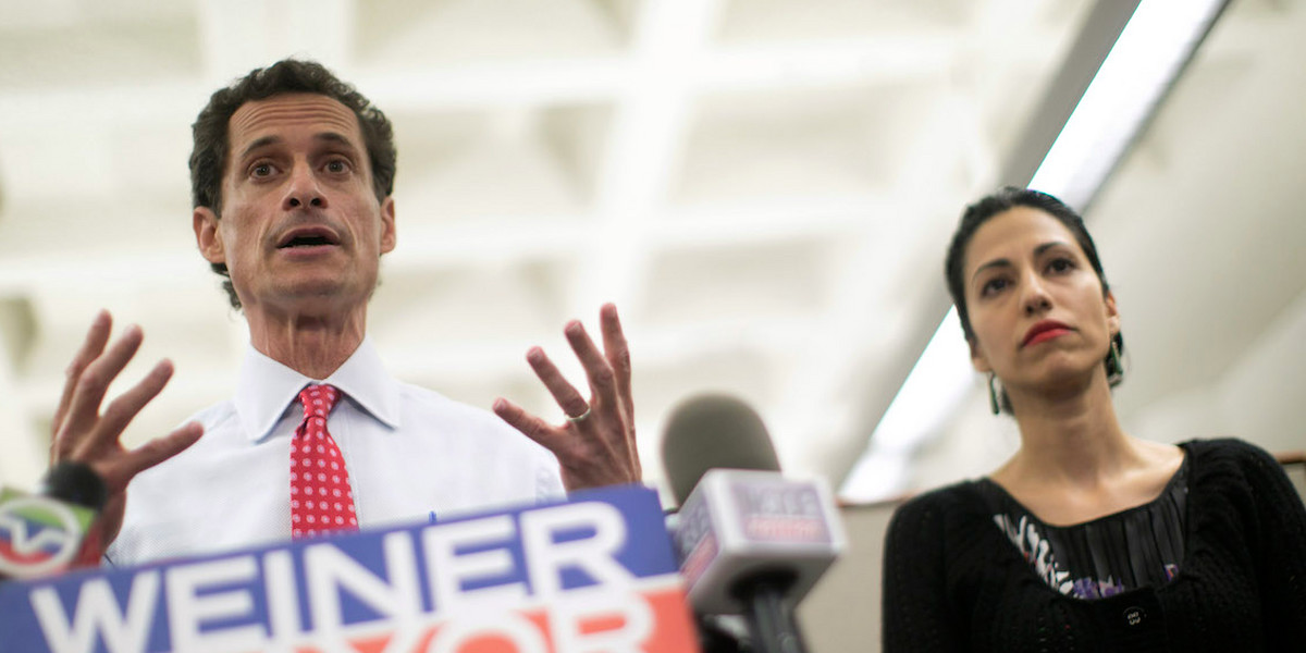 Anthony Weiner appears at a July 2013 press conference with his wife, Huma Abedin.