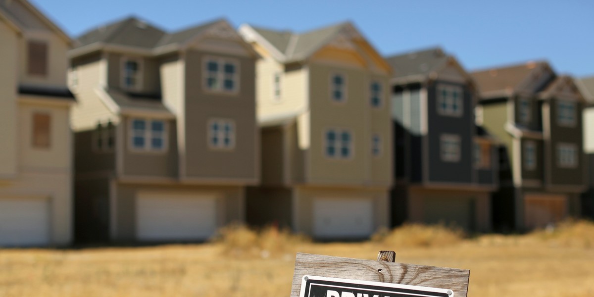 A sign near a cluster of vacant homes in Isleton, California.