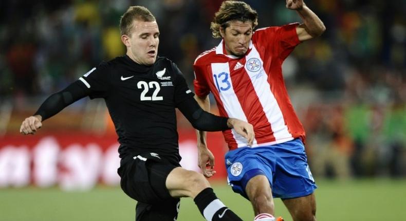 New Zealand's striker Jeremy Brockie (L) fights for the ball with Paraguay's midfielder Enrique Vera during the Group F first round 2010 World Cup football match Paraguay vs. New Zealand on June 24, 2010 at Peter Mokaba stadium in Polokwane. NO PUSH TO MOBILE / MOBILE USE SOLELY WITHIN EDITORIAL ARTICLE -- AFP PHOTO / JUAN MABROMATANew Zealand's striker Jeremy Brockie (L) fights for the ball with Paraguay's midfielder Enrique Vera during the Group F first round 2010 World Cup football match Paraguay vs. New Zealand on June 24, 2010 at Peter Mokaba stadium in Polokwane. NO PUSH TO MOBILE / MOBILE USE SOLELY WITHIN EDITORIAL ARTICLE -- AFP PHOTO / JUAN MABROMATA