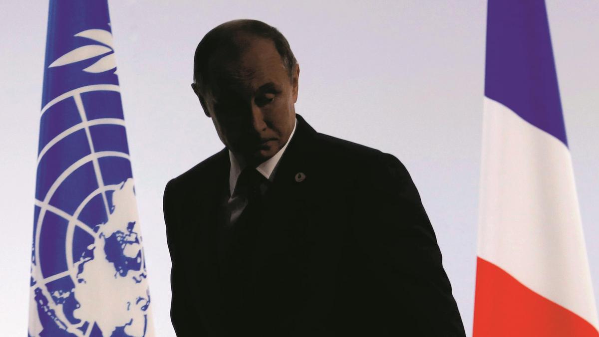 Russian President Putin leaves after delivering a speech for the opening day of the World Climate Ch