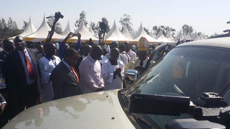 Deputy President William Ruto when he presented a brand new Mitsubishi Pajero as a gift to Most Rev Philip Anyolo 