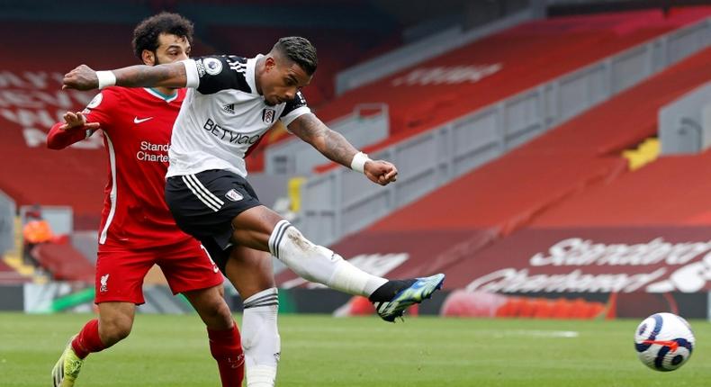 Liverpool star Mohamed Salah (L) cannot prevent Mario Lemina (R) scoring to give Fulham a shock victory at Anfield.