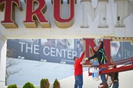 Williams, of Calvi Electric, lowers the 'M' letter from the signage of Trump Plaza Casino to his co-