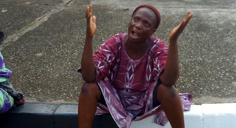 A parent of one of the kidnapped students of Lagos Model College Igbonla, protesting at Alausa