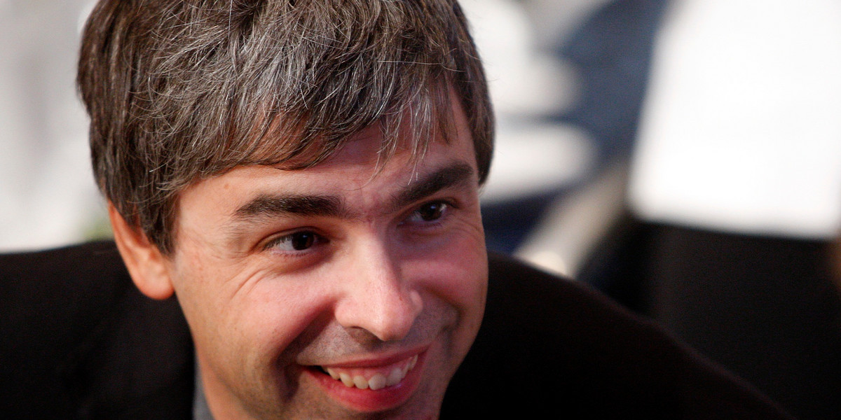 Google co-founder Larry Page speaks with people at his lunch table during the Clinton Global Initiative in New York September 27, 2007.