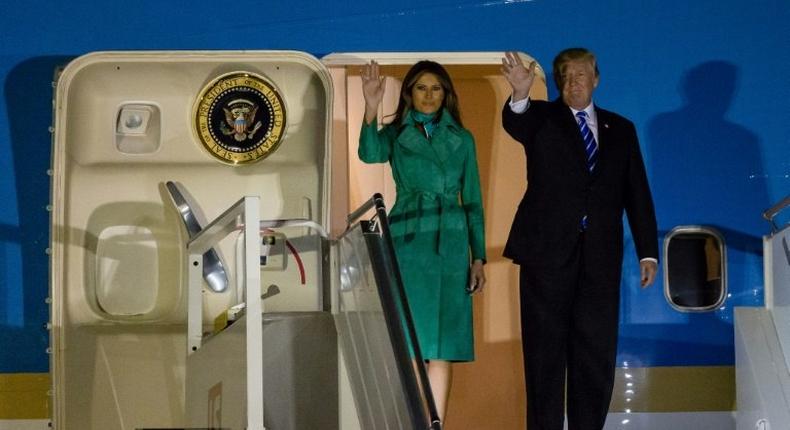 US President Donald Trump (R) and US First Lady Melania Trump (L) step off Air Force One upon their arrival at Chopin Airport in Warsaw, on July 5, 2017