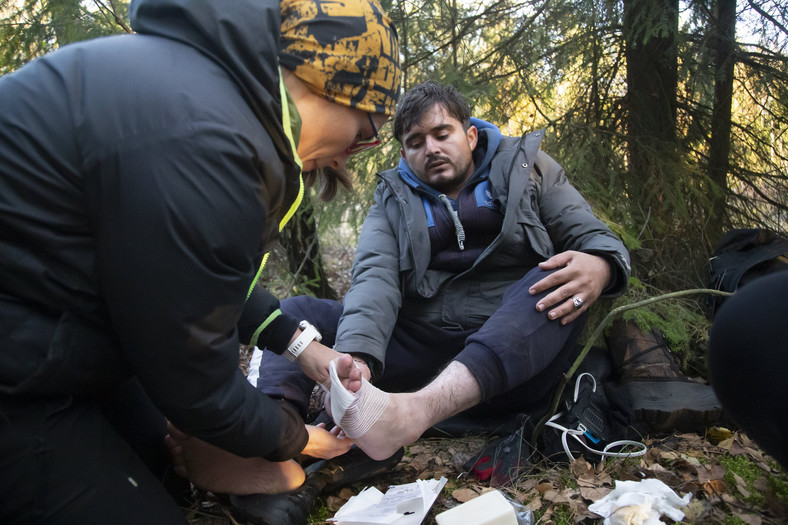 A man from Iraq in a Polish forest on a tour with Belarus