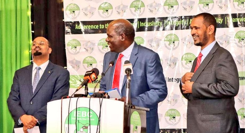 Outgoing IEBC Chair Wafula Chebukati and commissioners Boya Molu & Abdi Guliye during the launch of the Post-election Evaluation Report in Nairobi