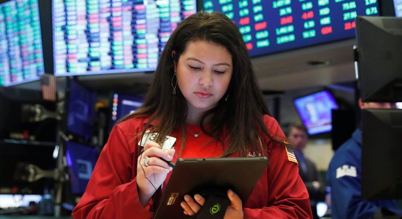 Traders work on the floor of the New York Stock Exchange shortly after the opening bell in New York, U.S., March 17, 2020.
