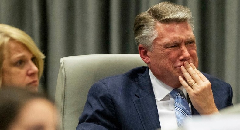 Mark Harris, Republican candidate in North Carolina's 9th Congressional race, fights back tears at the conclusion of his son John Harris's testimony during the third day of a public evidentiary hearing.