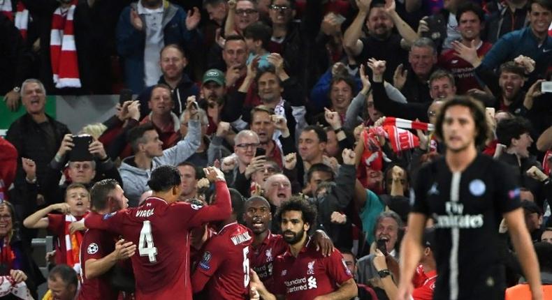 Liverpool midfielder James Milner celebrates with his team-mates