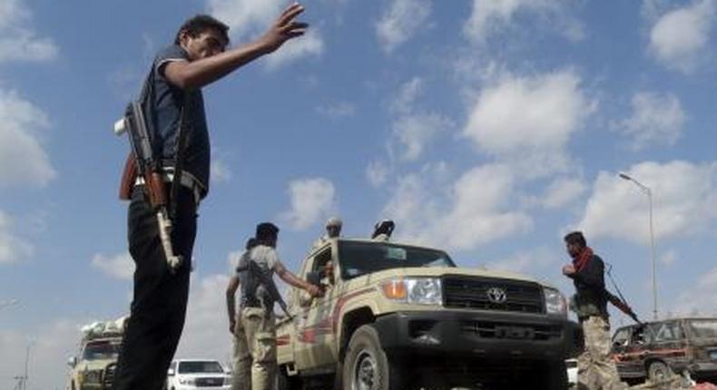 Members of the pro-government Popular Committees militia man a checkpoint at an entrance of Yemens southern port city of Aden December 3, 2015.