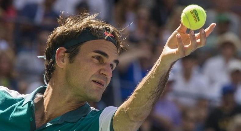 Roger Federer of Switzerland serves to Philipp Kohlschreiber of Germany during their third round match at the U.S. Open Championships tennis tournament in New York, September 5, 2015. REUTERS/Adrees Latif