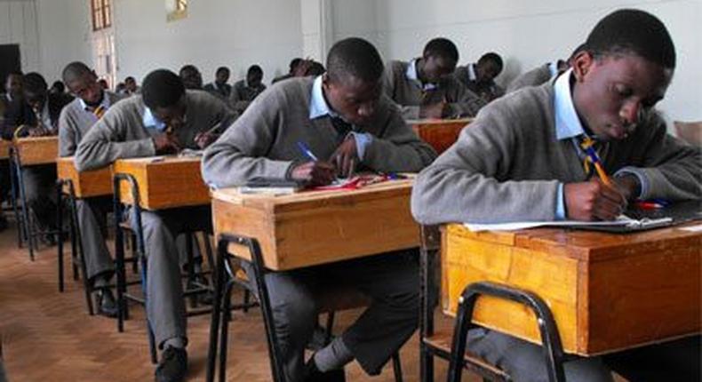 Students writing their KCSE