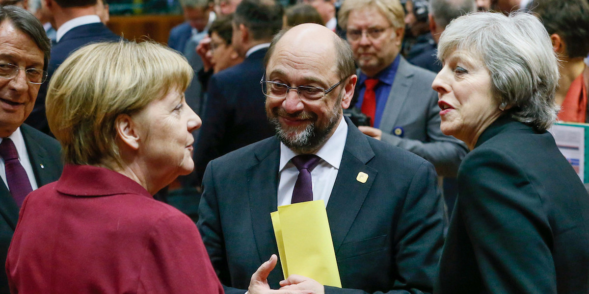 Germany's Chancellor Angela Merkel (L), European Parliament President Martin Schulz (C) and Britain's Prime Minister Theresa May attend a EU Summit at the European Council headquarters in Brussels, Belgium December 15, 2016.