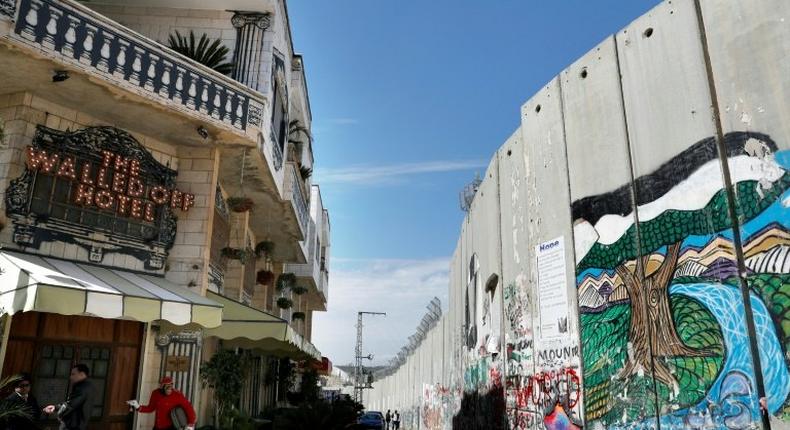 Street artist Banksy opened the Walled-Off Hotel next to Israel's controversial separation wall in Bethlehem on March 3