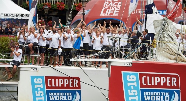 Crew members of Ichorcoal clap for one minute to commemorate two of their crew members, Andrew Ashman and Sarah Young, who both lost their lives during the 2015-16 Clipper Round the World Yacht Race during the prize ceremony July 30, 2016