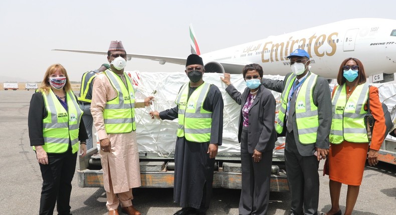 Nigerians officials, including the Minister of Health, Dr. Osagie Ehanire, receive the 3.92 million doses of AstraZeneca COVID-19 vaccine on arrival. [Twitter/@WHONigeria]