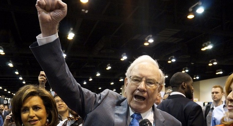 Berkshire Hathaway CEO Warren Buffett yells Go big red!, the Nebraska Cornhuskers chant, prior to the Berkshire annual meeting in Omaha