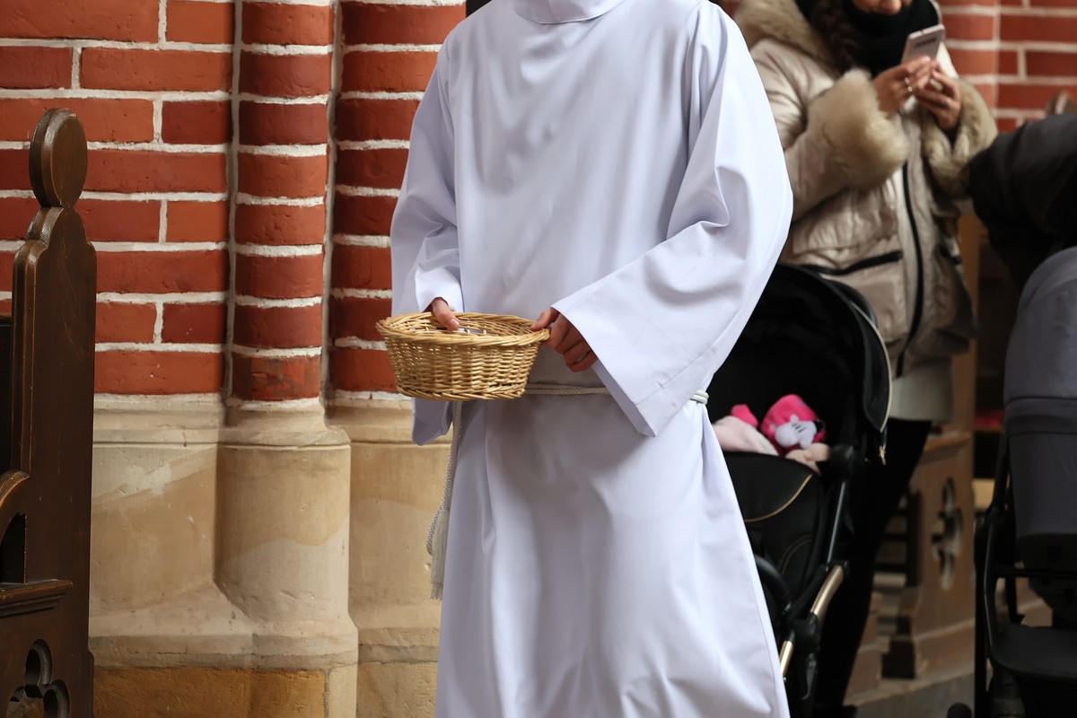 The,Altar,Boy,Collects,Donations,To,The,Basket,From,The